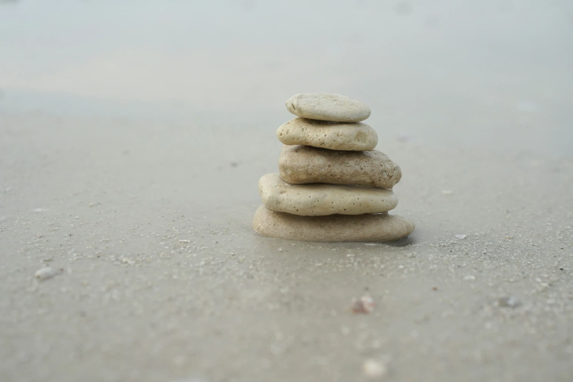 Balanced stones representing NATURECURE's philosophy of natural harmony and balance